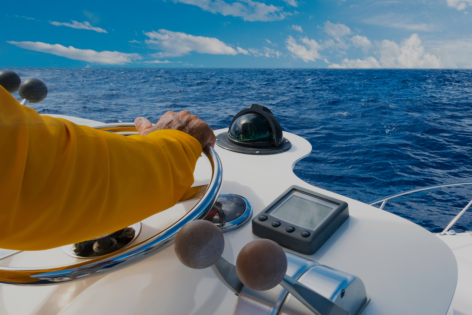 Hand steering a boat on open water, symbolizing control, direction, and the “think-like-an-owner” mindset in business.