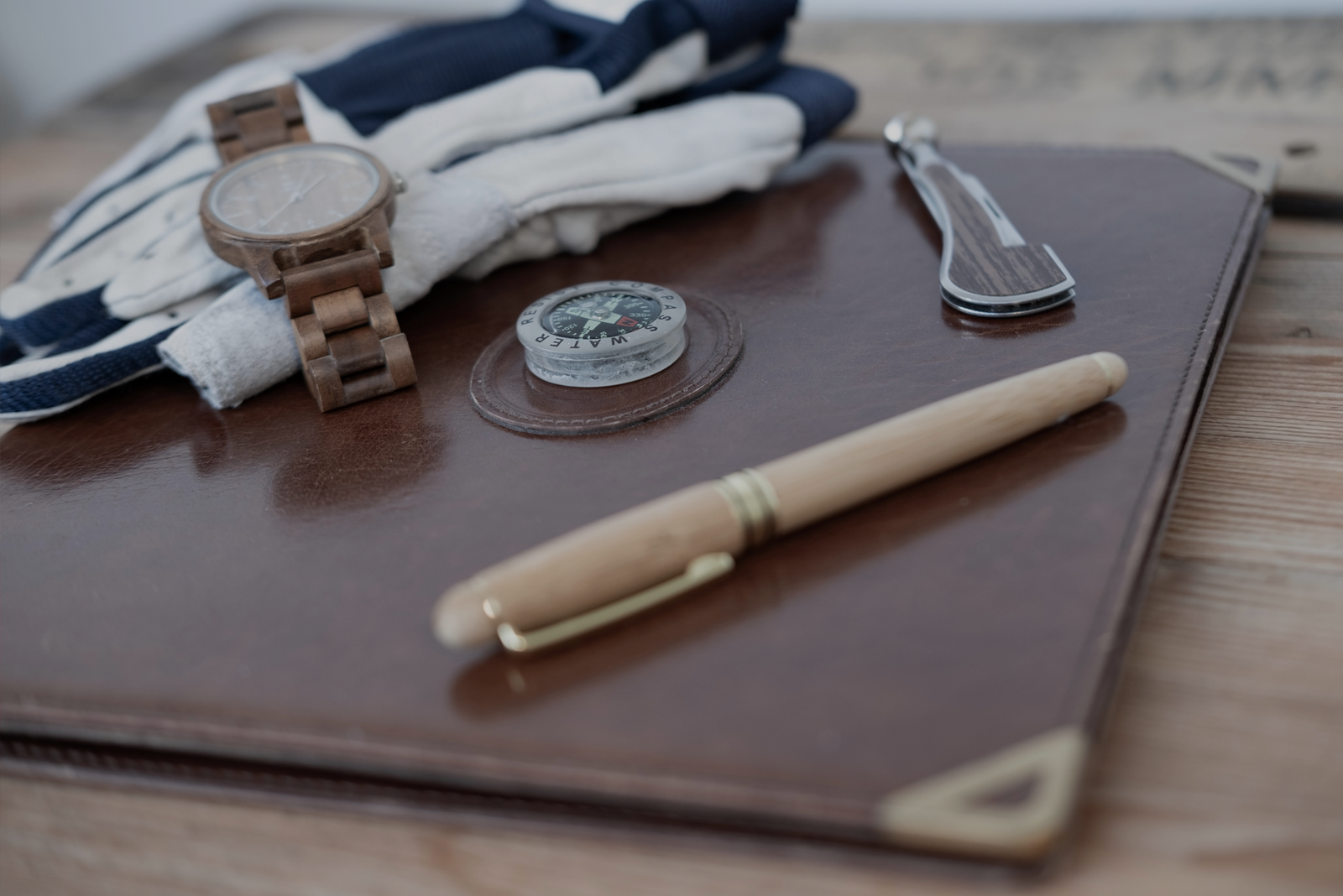 Watch, pen, and compass with text overlay about a big update to the USCG captain’s license recency requirement.