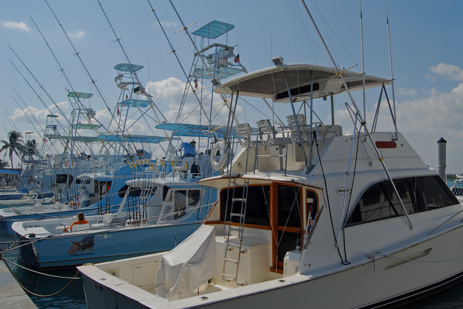 Several fishing boats docked at a marina.