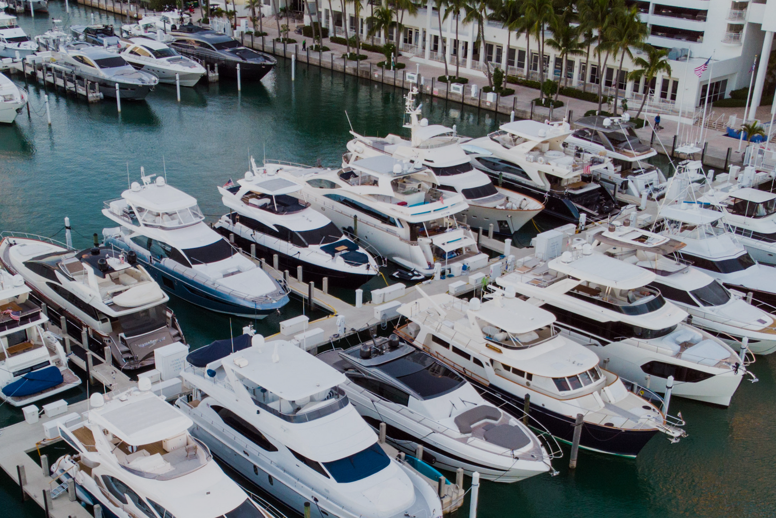 Several charter boats tied up at a dock, representing the importance of setting prices that actually pay you.