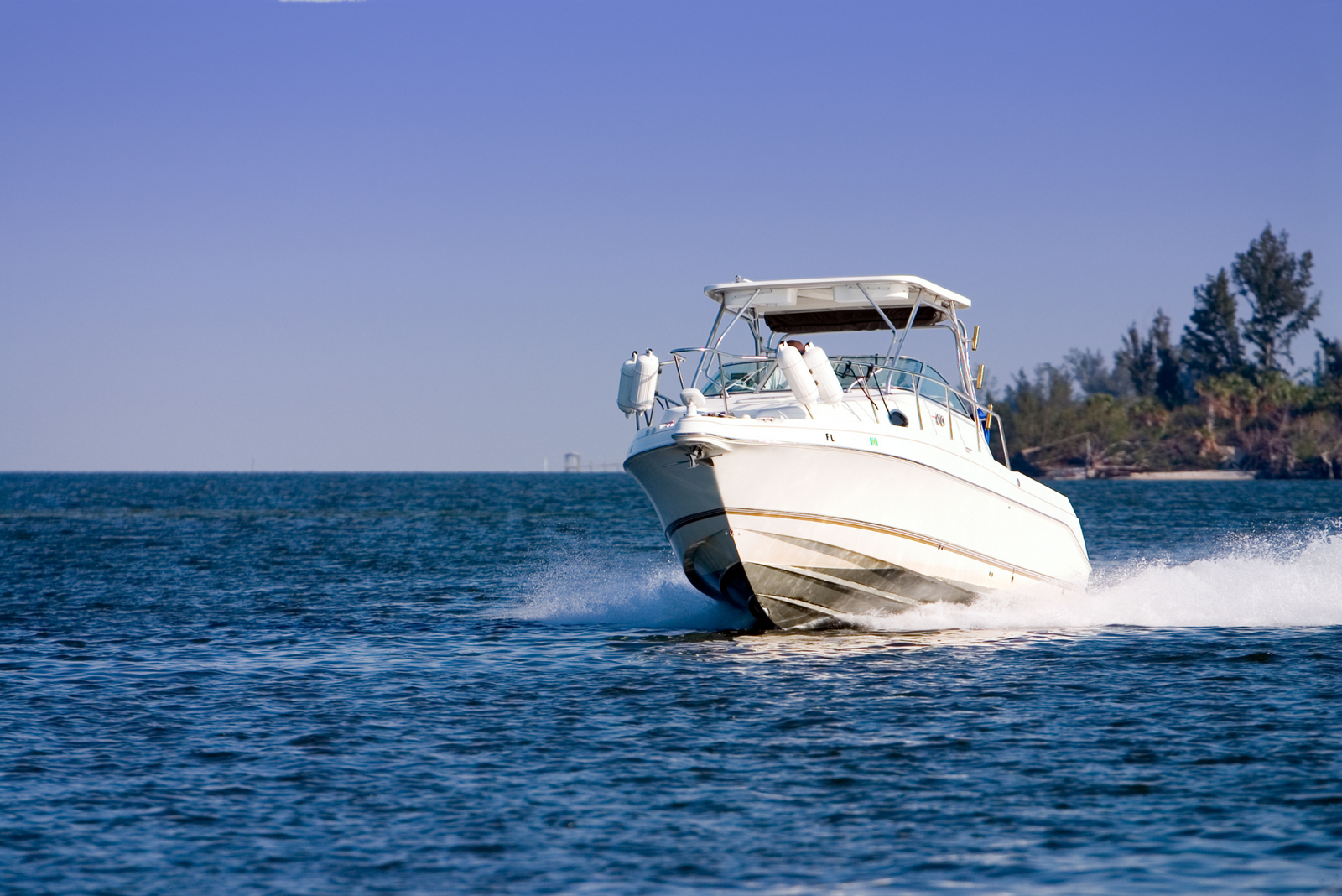 A motorized boat moved across blue waters in California.