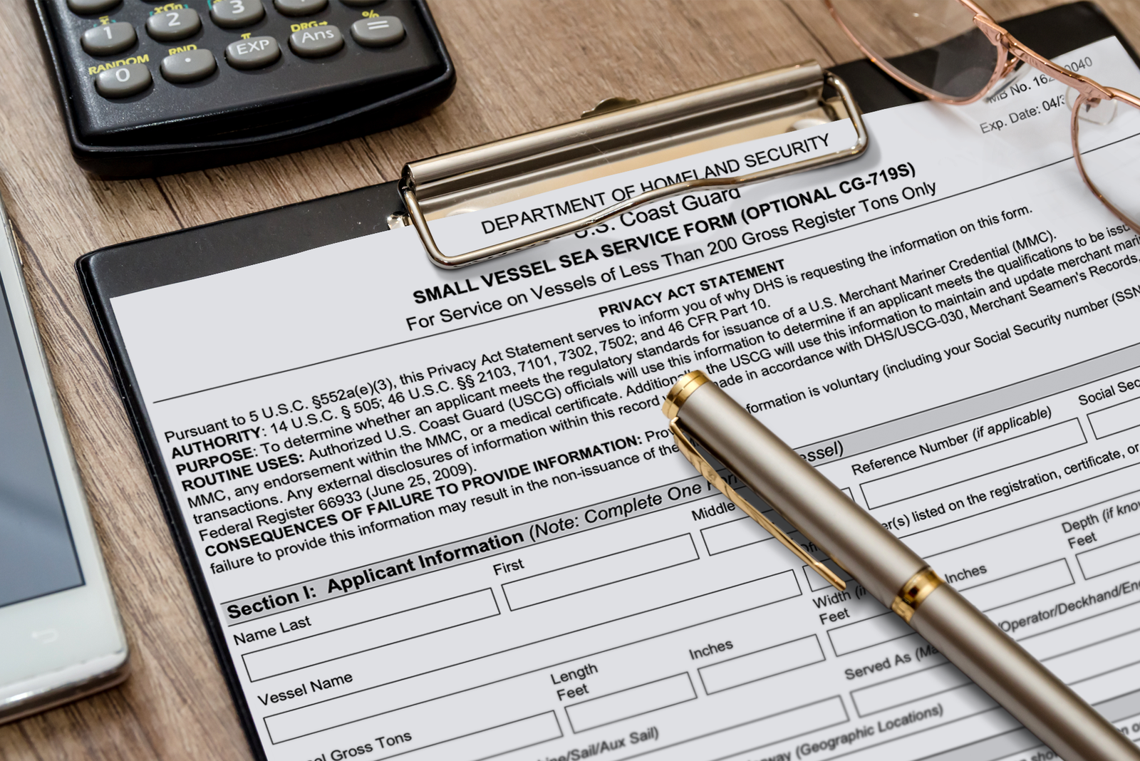 Small vessel sea service form on a clipboard with a pen, ready to record sea time for a captain’s license.