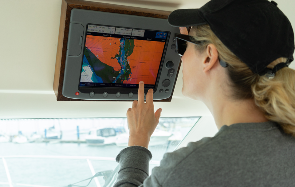 woman navigating boat