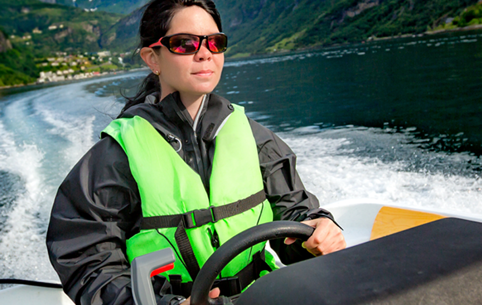 woman driving power boat
