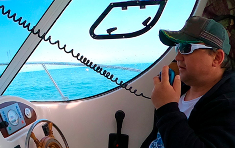 man using boat radio