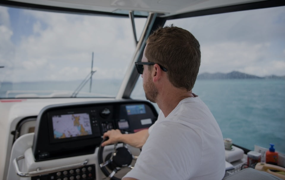 man driving boat
