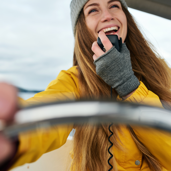 woman using radio on boat