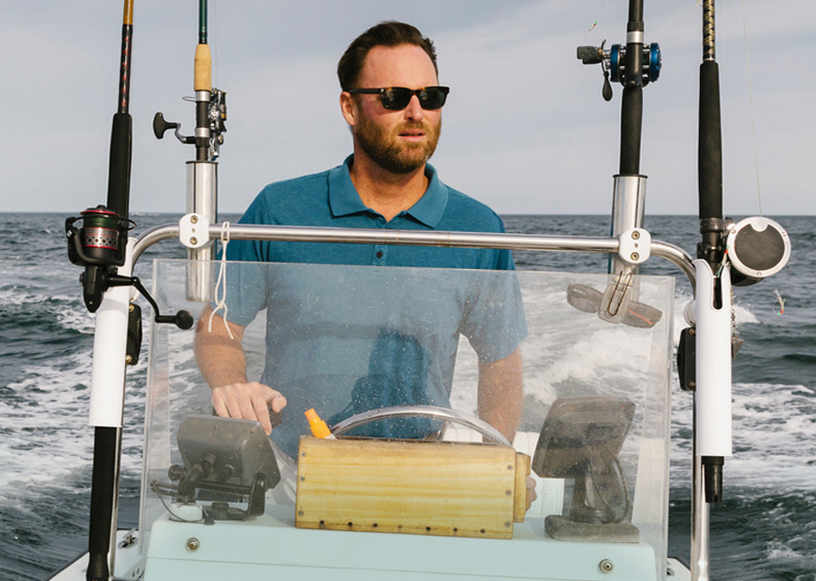 Man Driving a Power Boat