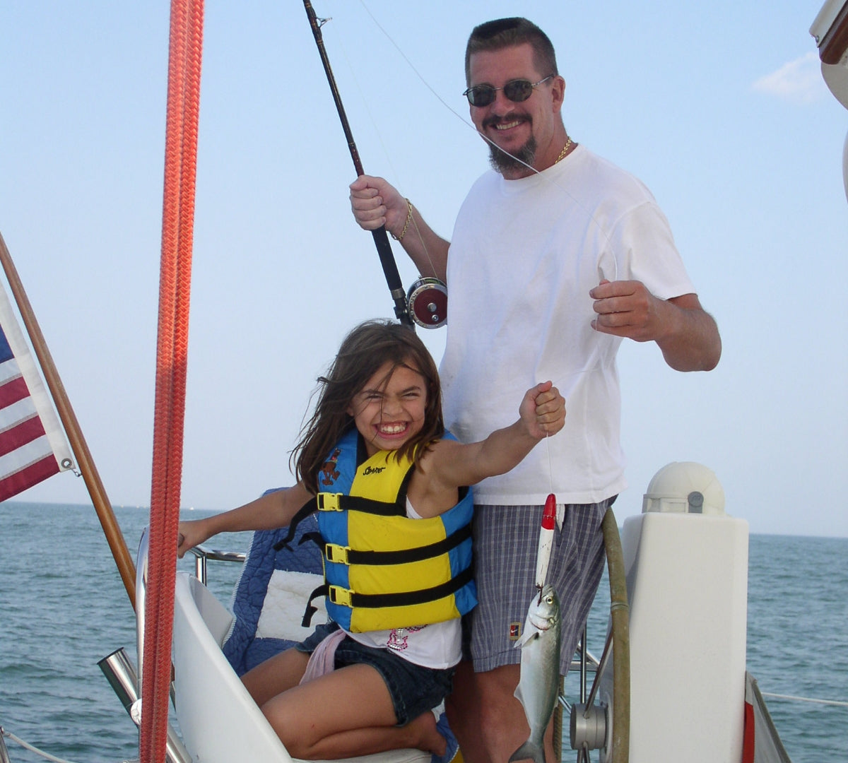 father and daughter on boat
